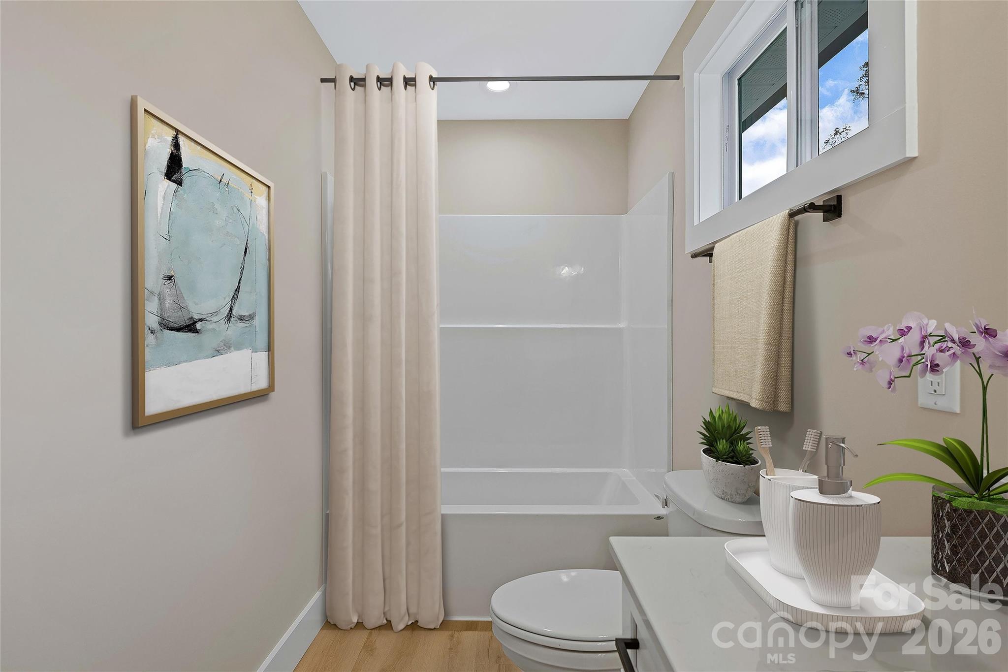 424 Hazel Mill Road Asheville, NC 28806 - Photo 45 of 47 a bathroom with a toilet a sink and shower