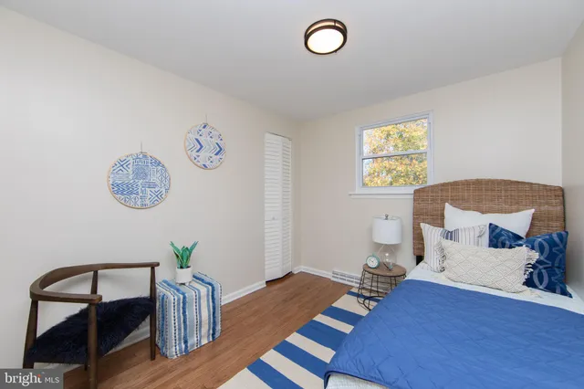 a bedroom with a bed and a table