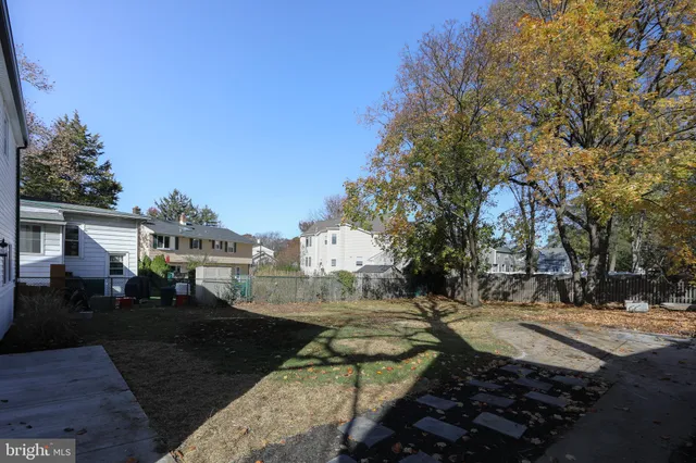 a view of a street with houses on both side