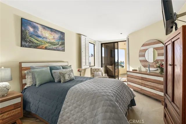 a bedroom with a bed and a mirror