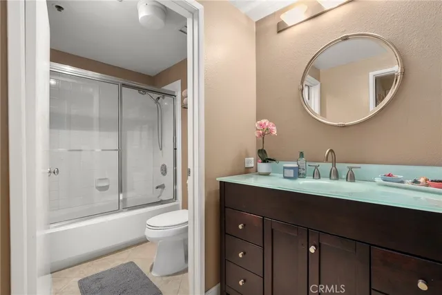 a living room with furniture a window and a projector