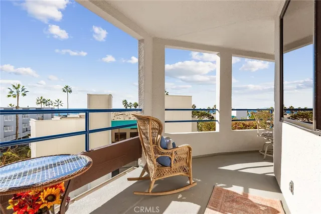 a view of a kitchen with kitchen island granite countertop a large window and a counter top space