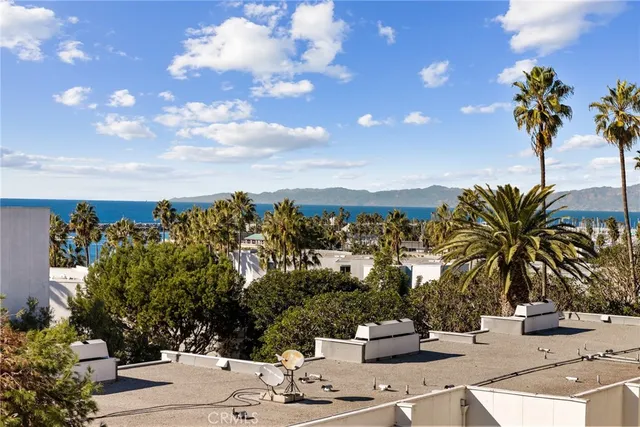 a kitchen with stainless steel appliances granite countertop a refrigerator and a stove
