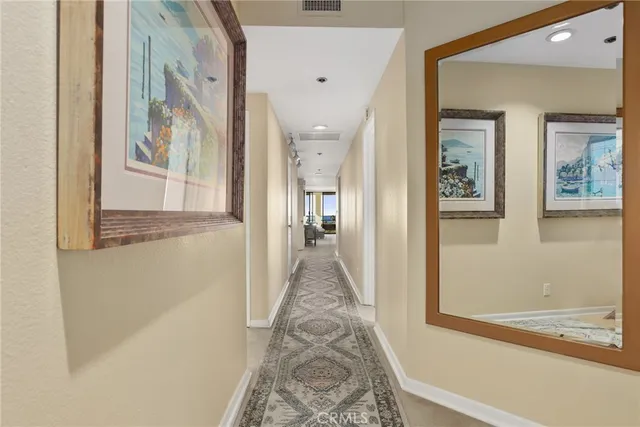 a kitchen with stainless steel appliances granite countertop a refrigerator a stove and a wooden floors