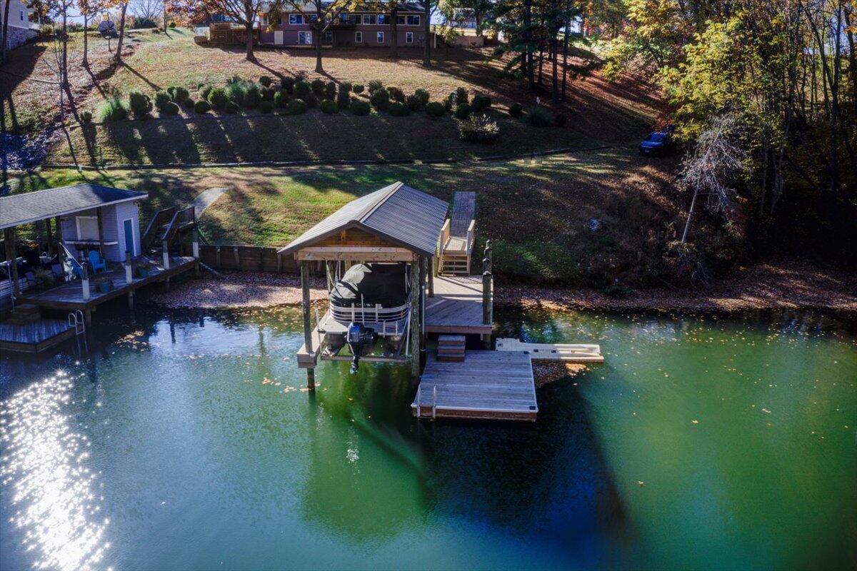 448 Lakeside Road Penhook, VA 24137 - Photo 1 of 51 a aerial view of a house with swimming pool garden and patio