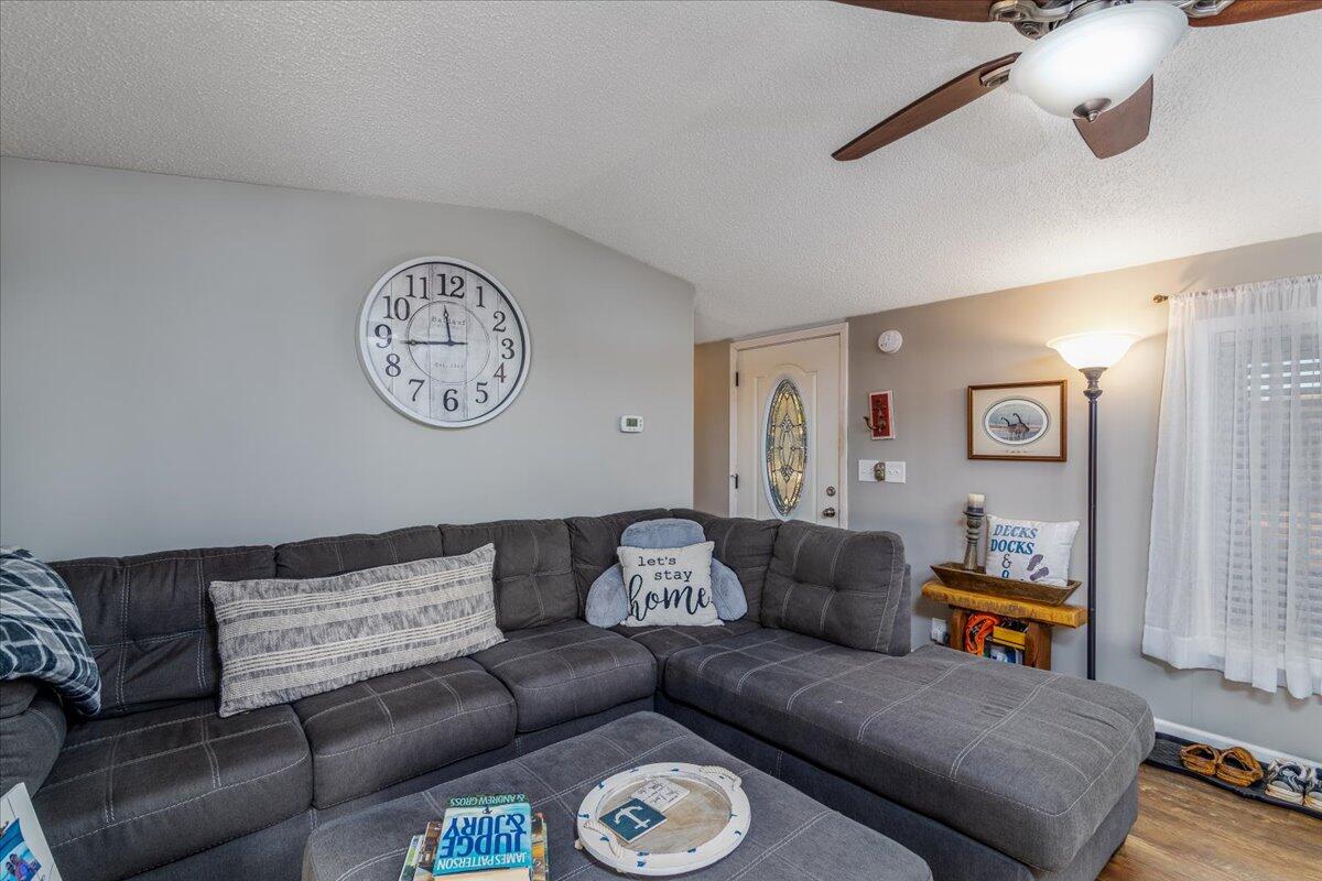 448 Lakeside Road Penhook, VA 24137 - Photo 11 of 51 a living room with furniture and a window