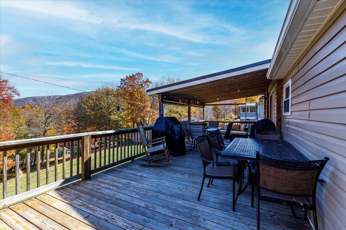 448 Lakeside Road Penhook, VA 24137 - Photo 14 of 51 a view of a deck with furniture