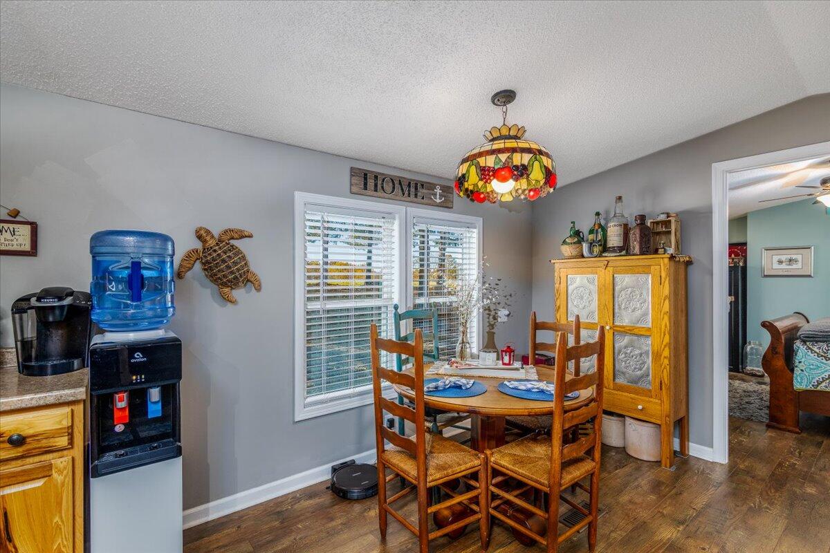 448 Lakeside Road Penhook, VA 24137 - Photo 19 of 51 a dining room with a wooden table and chairs