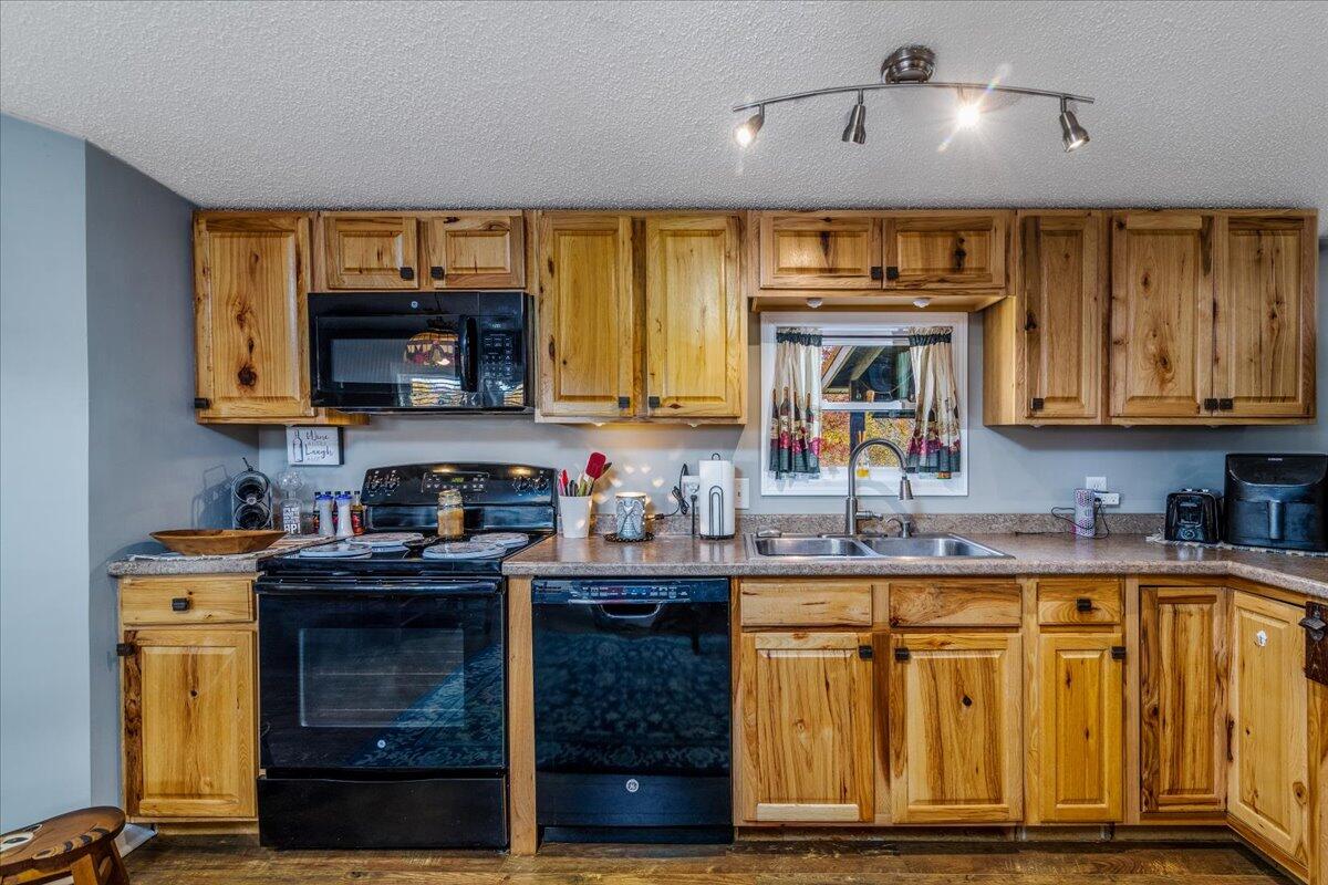 448 Lakeside Road Penhook, VA 24137 - Photo 21 of 51 a kitchen with stainless steel appliances granite countertop a sink and cabinets