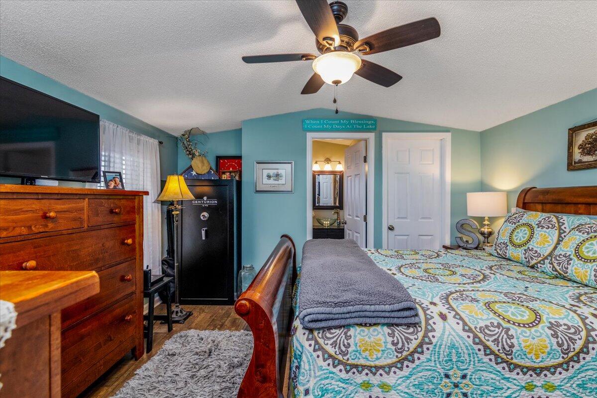 448 Lakeside Road Penhook, VA 24137 - Photo 23 of 51 a bedroom with furniture and a flat screen tv