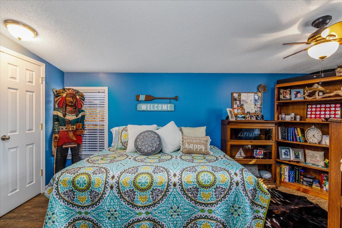 448 Lakeside Road Penhook, VA 24137 - Photo 26 of 51 a bedroom with furniture and a book shelf