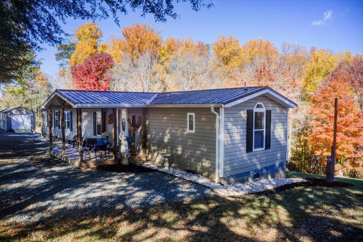 448 Lakeside Road Penhook, VA 24137 - Photo 28 of 51 a view of a house with yard and sitting area