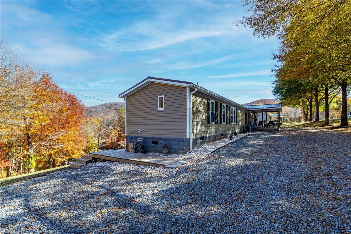 448 Lakeside Road Penhook, VA 24137 - Photo 30 of 51 a view of a house with a yard