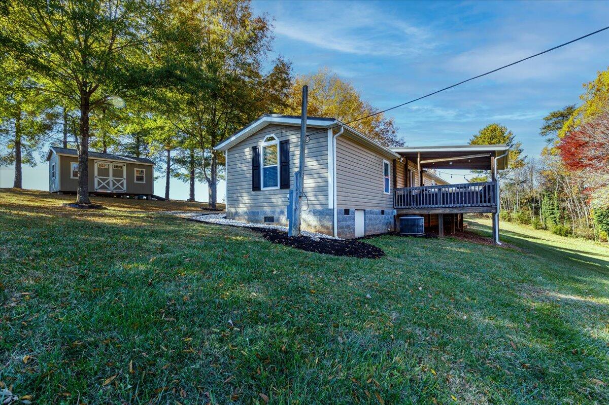 448 Lakeside Road Penhook, VA 24137 - Photo 33 of 51 a front view of house with yard and seating space