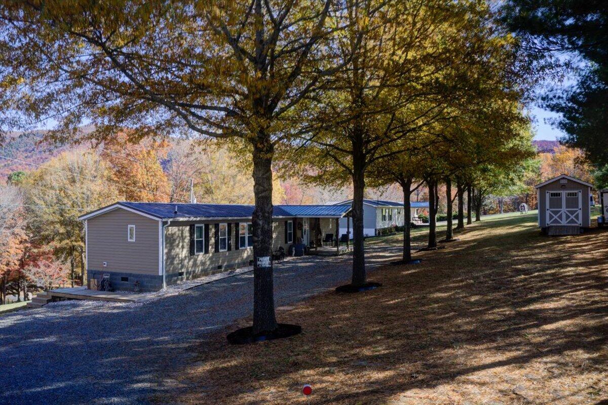 448 Lakeside Road Penhook, VA 24137 - Photo 36 of 51 a view of a house with a yard