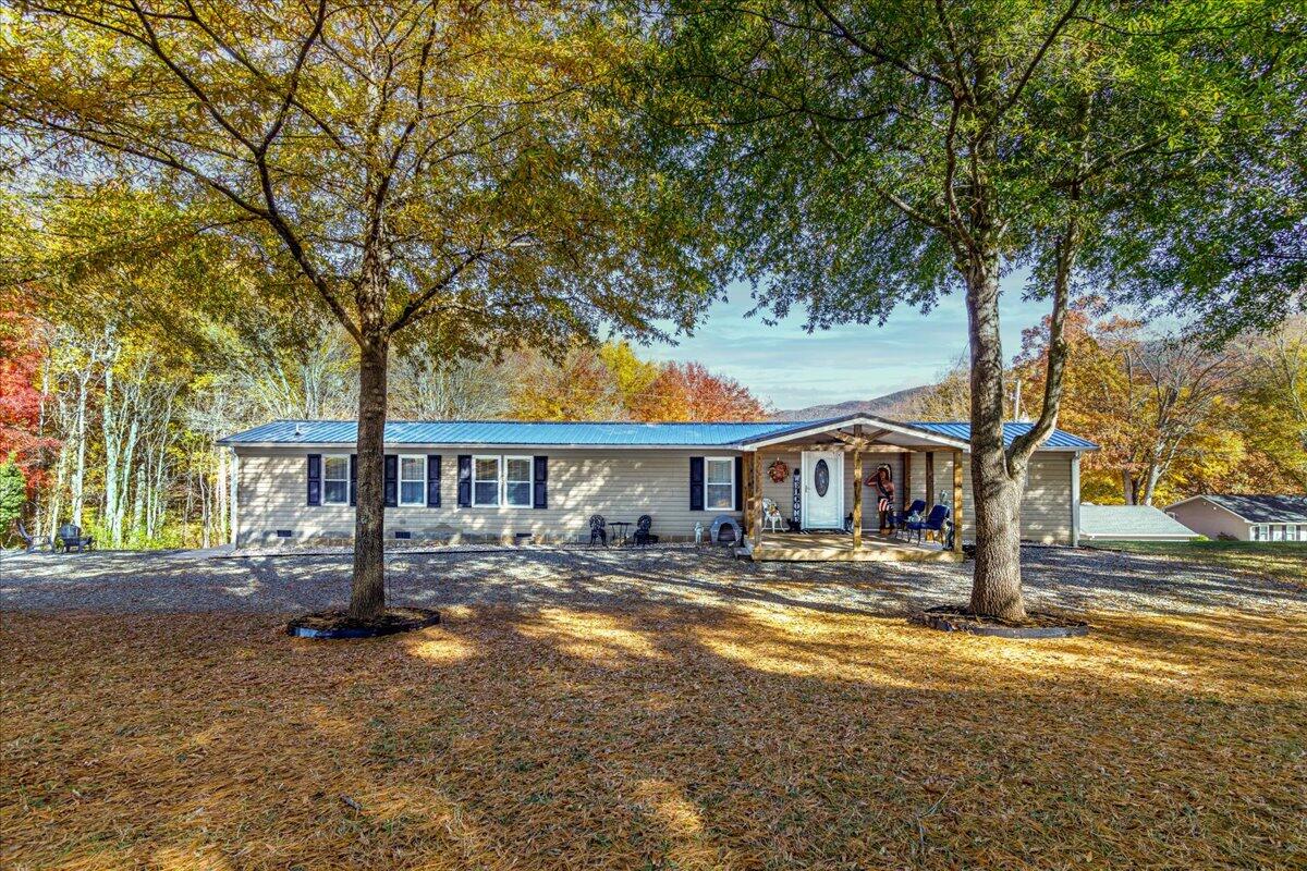 448 Lakeside Road Penhook, VA 24137 - Photo 6 of 51 a front view of a house with a tree s
