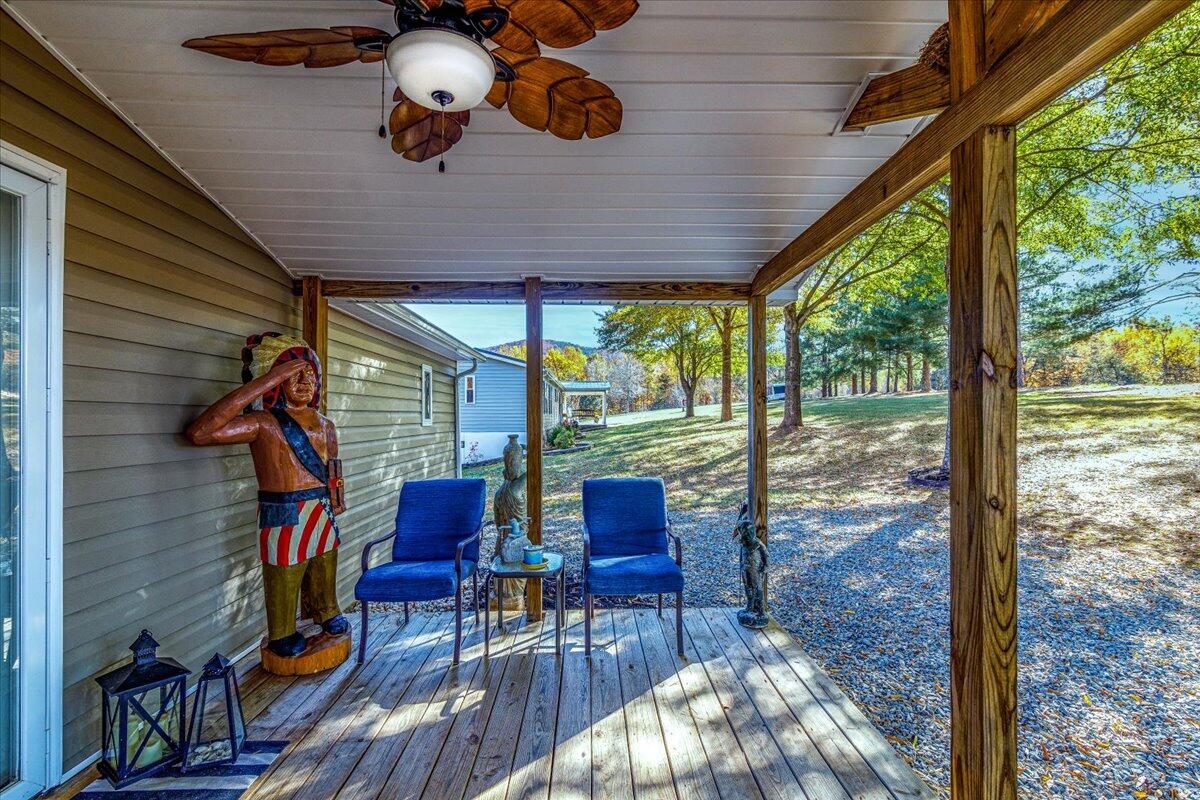 448 Lakeside Road Penhook, VA 24137 - Photo 9 of 51 a dining room with wooden floor table and chairs