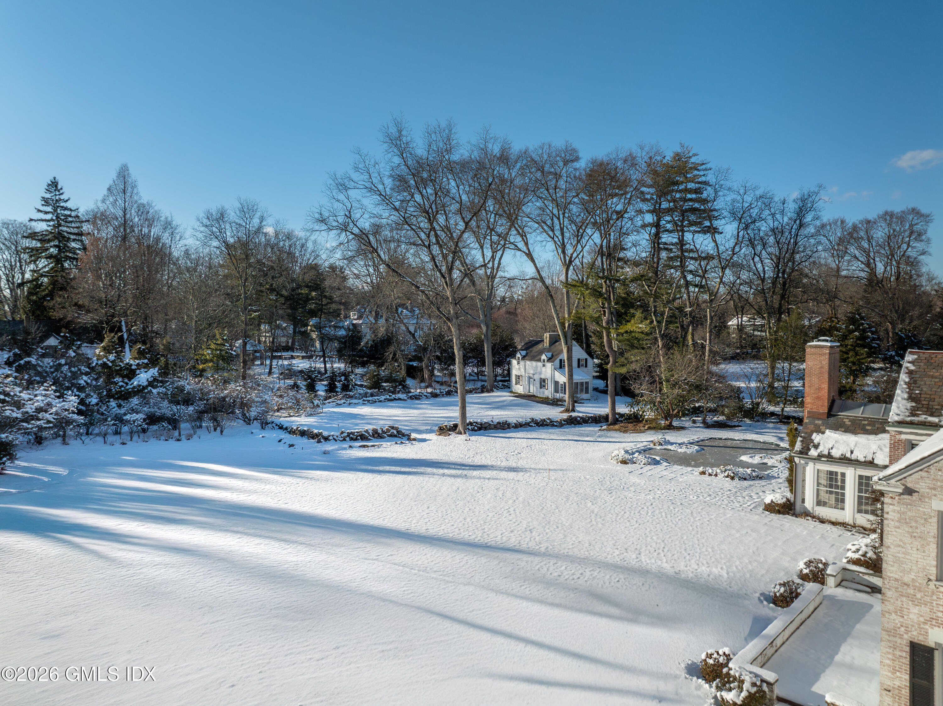 12 Woodside Road Greenwich, CT 06830 - Photo 4 of 11 a view of road with trees