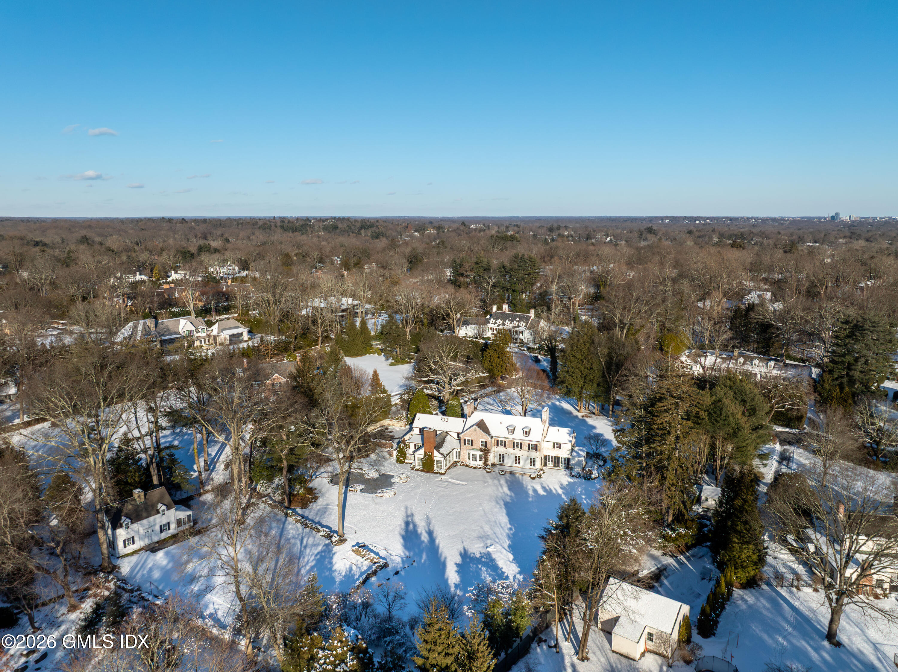 12 Woodside Road Greenwich, CT 06830 - Photo 7 of 11 an aerial view of house with yard and mountain view in back
