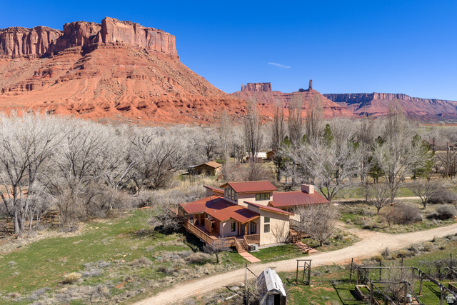 423 Amber Lane Moab, UT 84532 - Photo 45 of 63 West side of home with view of Parriott mesa and Castleton Tower.