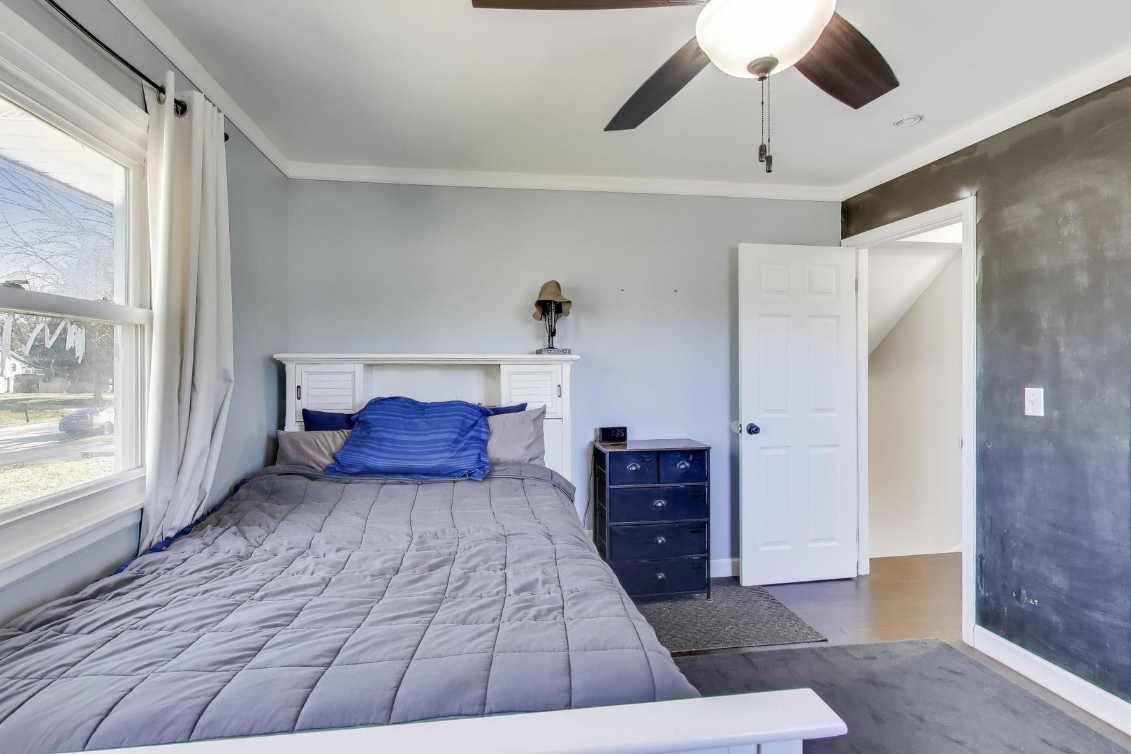 046 North Page Street Winfield, IL 60190 - Photo 12 of 32 a room with a bed and large windows