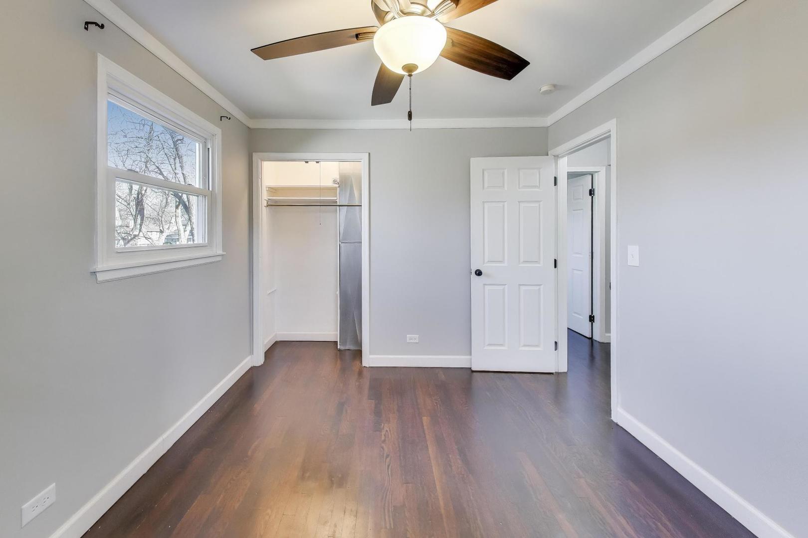046 North Page Street Winfield, IL 60190 - Photo 14 of 32 wooden floor in an empty room with a window