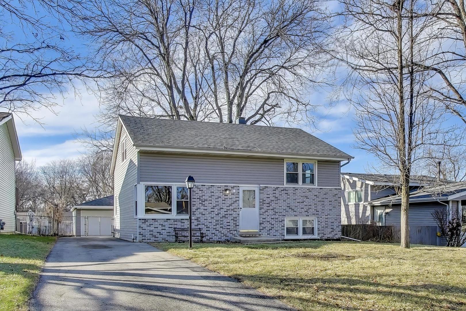 046 North Page Street Winfield, IL 60190 - Photo 2 of 32 a view of a house with a yard