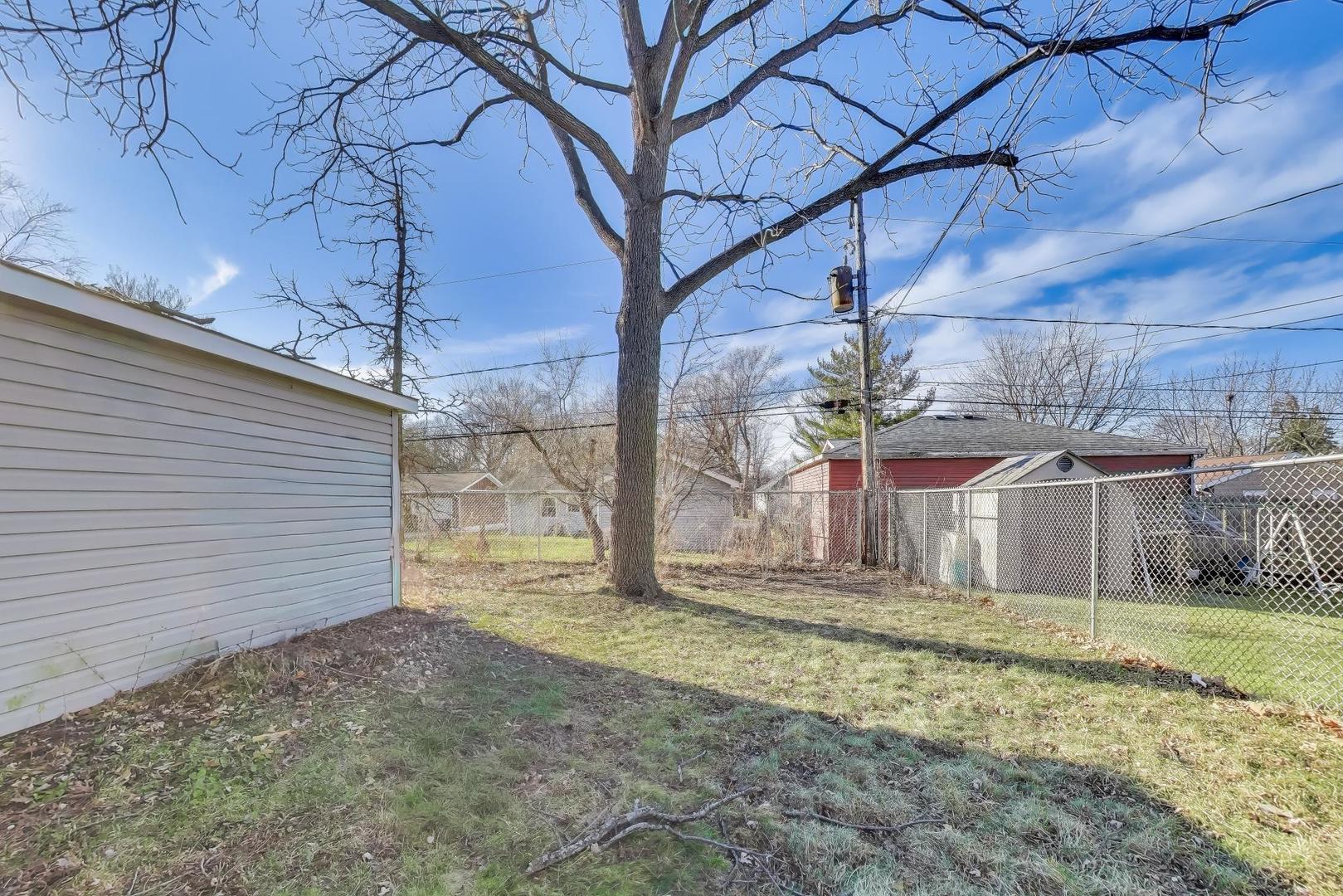 046 North Page Street Winfield, IL 60190 - Photo 26 of 32 a view of a backyard of the house