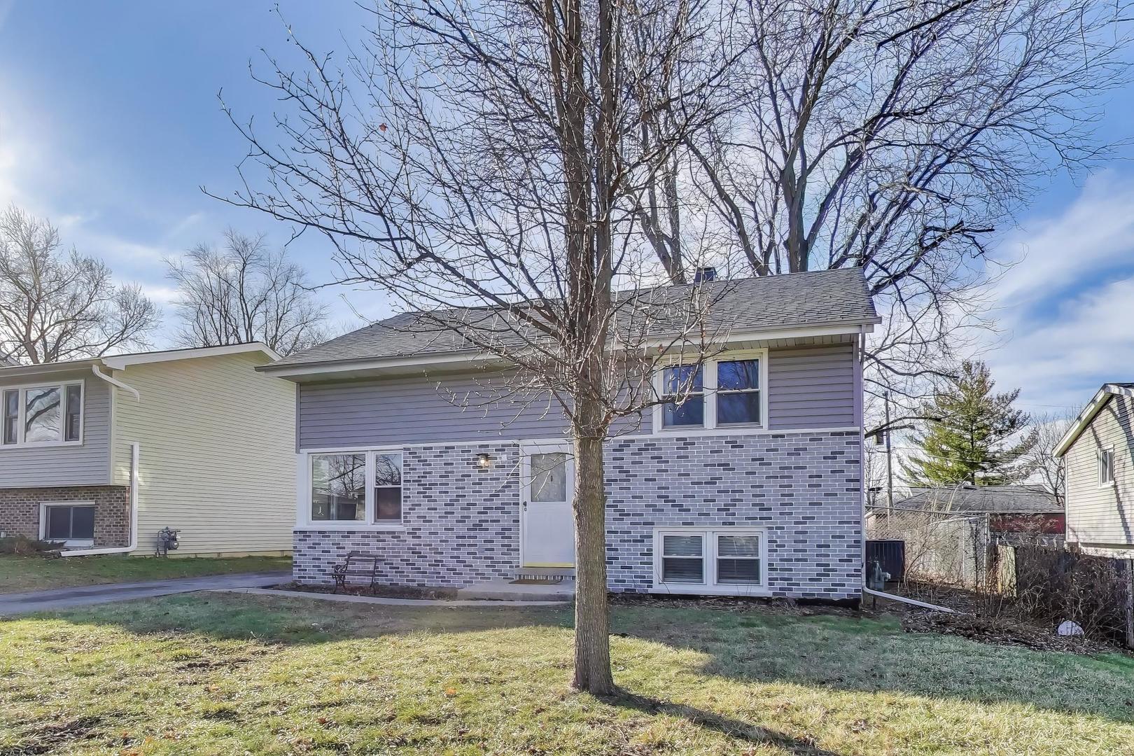 046 North Page Street Winfield, IL 60190 - Photo 3 of 32 a front view of a house with a yard