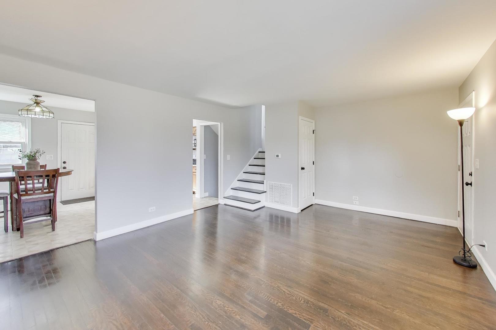 046 North Page Street Winfield, IL 60190 - Photo 6 of 32 an empty room with wooden floor and windows