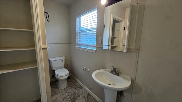 a bathroom with a sink and a toilet