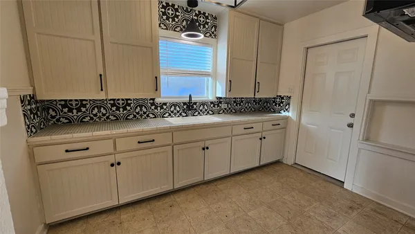 a view of cabinets and window
