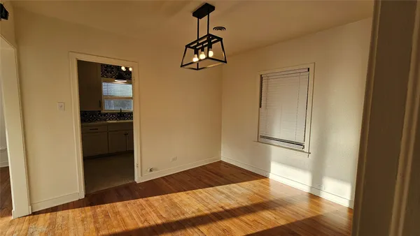 a view of a kitchen from the hallway