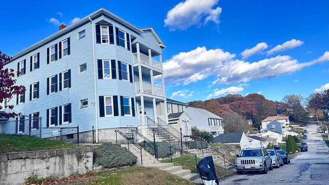 a view of multiple houses with a road