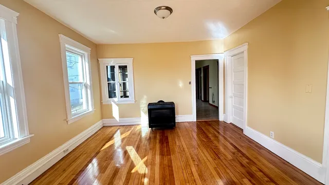 a room with a bed and a window