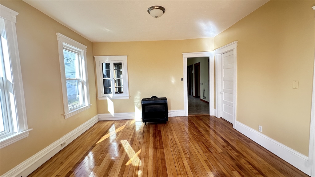 3 Bowker Street Worcester, MA 01604 - Photo 14 of 42 a room with a bed and a window