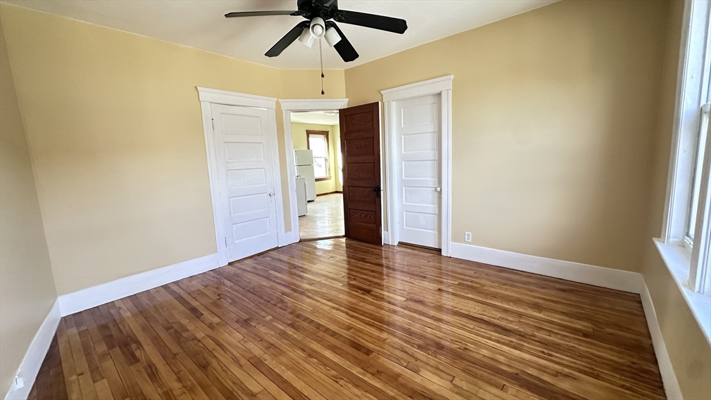 3 Bowker Street Worcester, MA 01604 - Photo 19 of 42 a view of empty room with wooden floor and fan