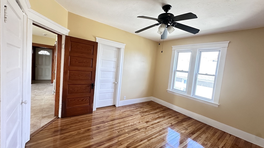 3 Bowker Street Worcester, MA 01604 - Photo 20 of 42 wooden floor in an empty room with a window