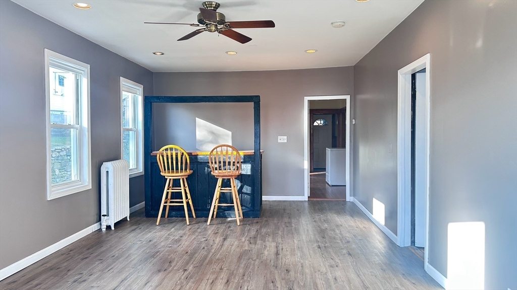 3 Bowker Street Worcester, MA 01604 - Photo 2 of 42 a dining room with furniture and wooden floor