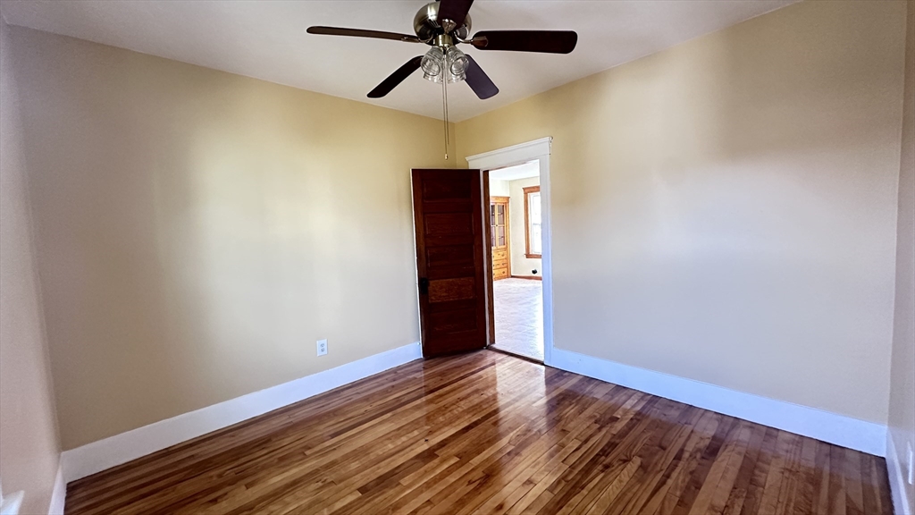 3 Bowker Street Worcester, MA 01604 - Photo 22 of 42 a view of room with hardwood floor and ceiling fan