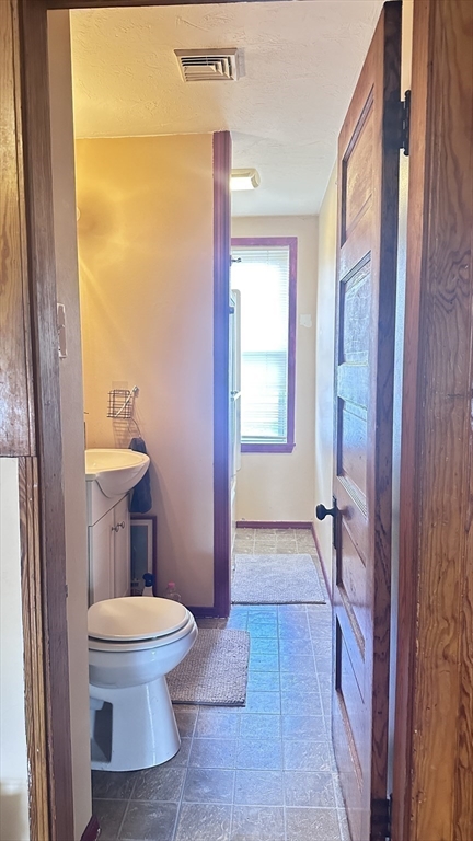 3 Bowker Street Worcester, MA 01604 - Photo 31 of 42 a bathroom with a toilet and a shower