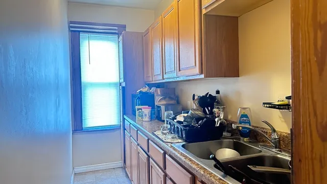 a bedroom with a bed and a book shelf