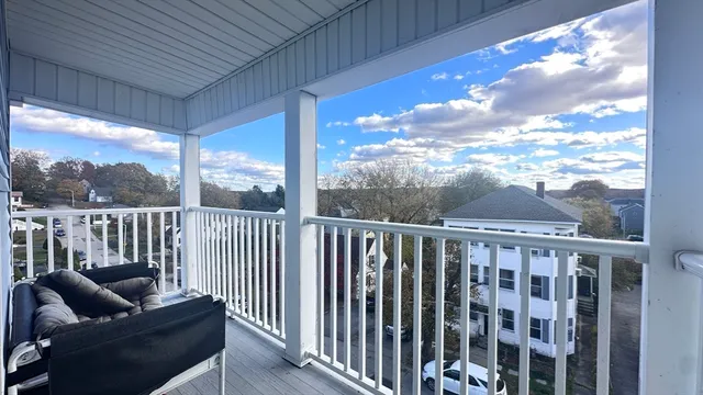 a view of a patio with a table and chairs