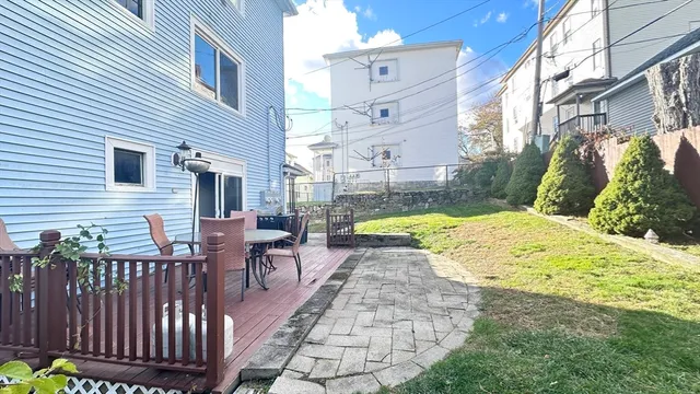a view of a house with a yard porch and sitting area
