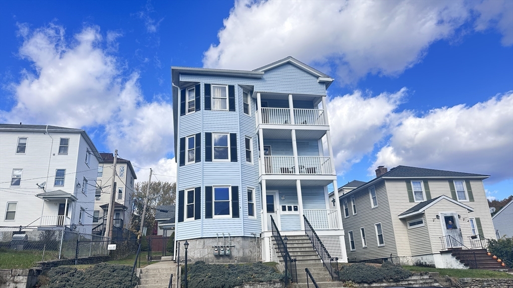 3 Bowker Street Worcester, MA 01604 - Photo 42 of 42 a front view of a house with a yard