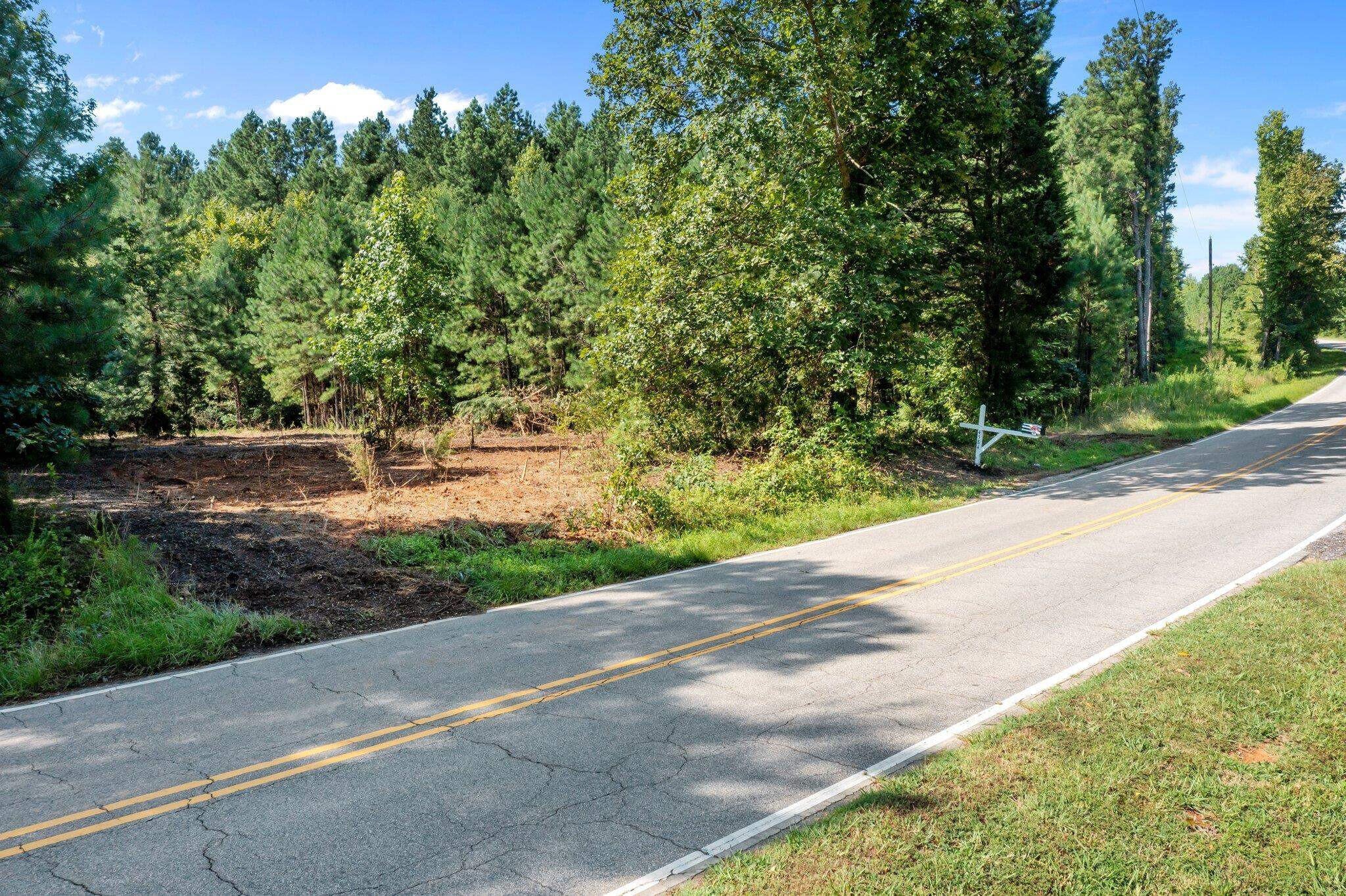 0 Stagecoach Road Henderson, NC 27537 - Photo 8 of 16 a backyard of a house with lots of green space