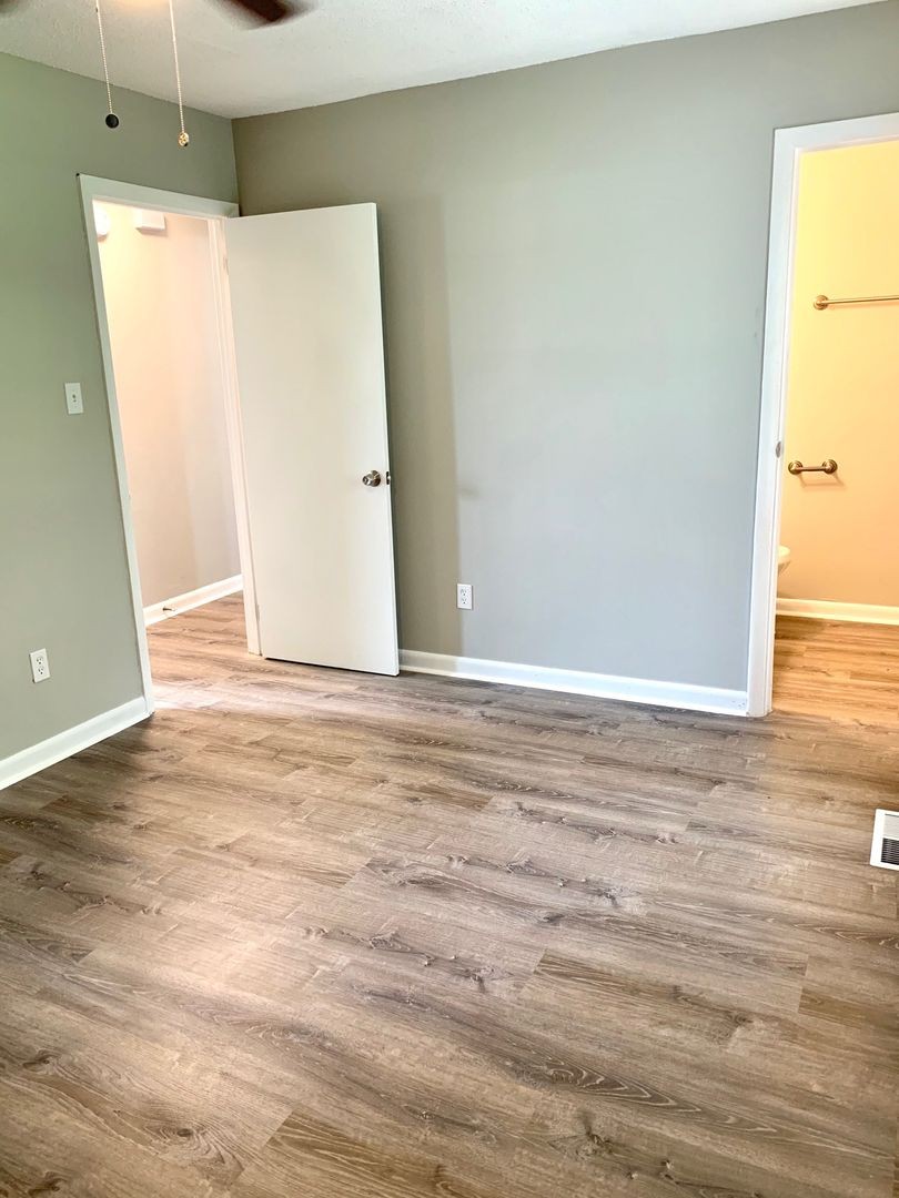 208 State Line Road Clarksville, TN 37042 - Photo 14 of 23 a view of a room with wooden floor