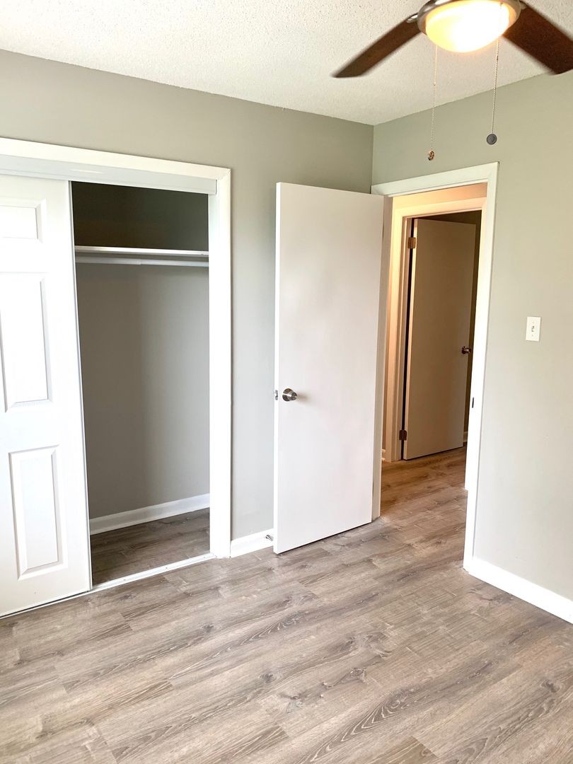 208 State Line Road Clarksville, TN 37042 - Photo 17 of 23 a view of an empty room with wooden floor and closet