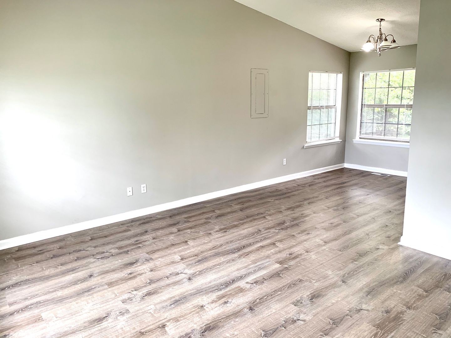 208 State Line Road Clarksville, TN 37042 - Photo 3 of 23 an empty room with wooden floor and windows