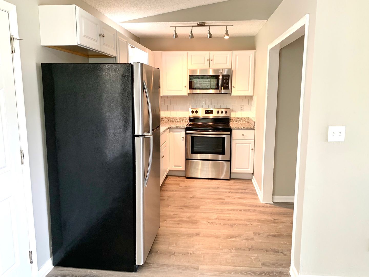 208 State Line Road Clarksville, TN 37042 - Photo 6 of 23 a kitchen with stainless steel appliances a refrigerator and a stove top oven